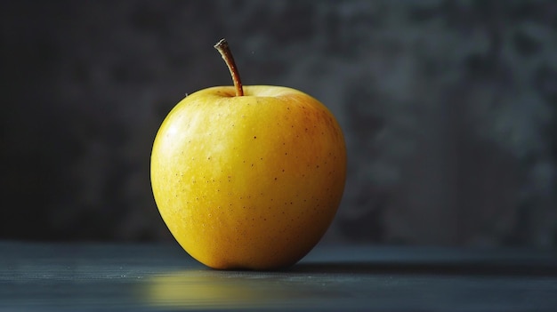 a yellow apple with a brown spot on the top of it