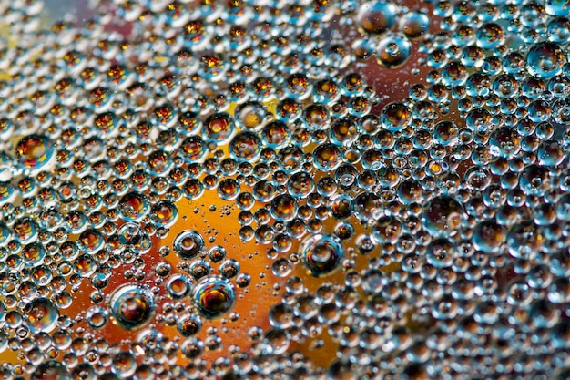 Yellow background. Abstract macrophotography. Oil bubbles. Water texture.