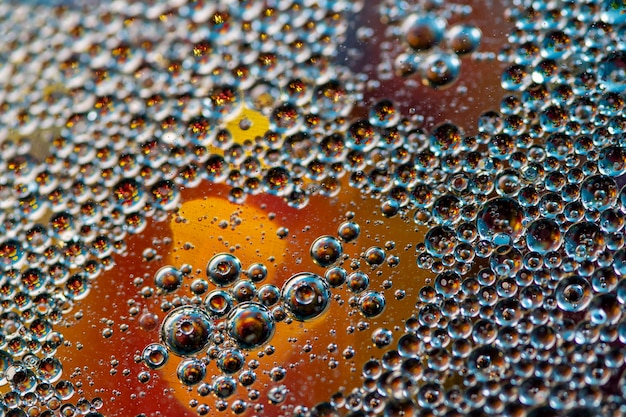 Yellow background. Abstract macrophotography. Oil bubbles. Water texture.