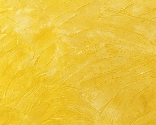 a yellow background with a pattern of a yellow paint with a rough texture