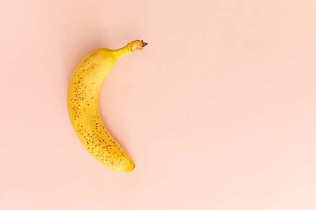 Yellow Banana Isolated over Pink Background