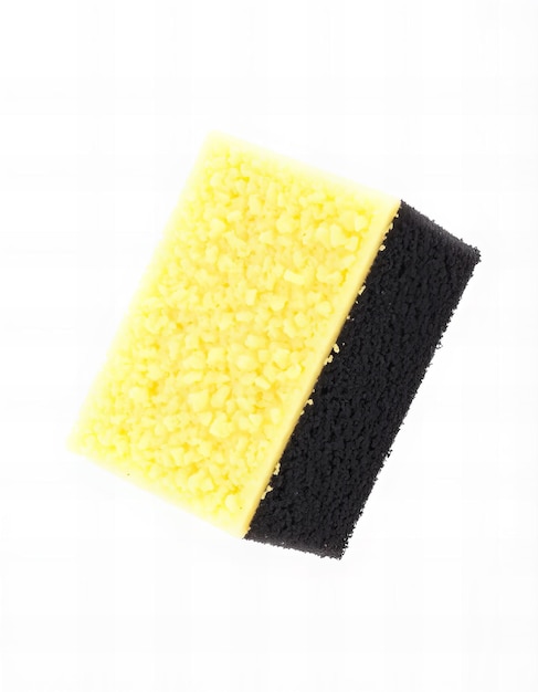 Photo a yellow and black sponge with a black stripe