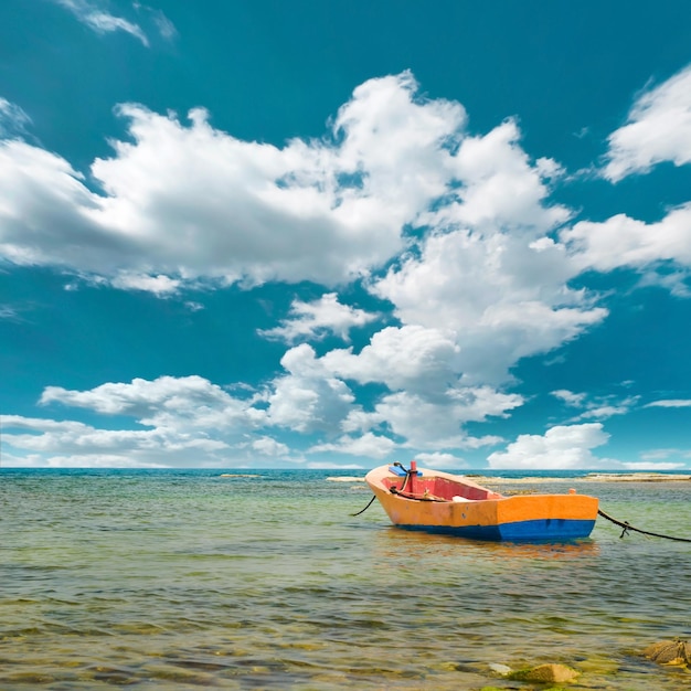 Yellow boat on a beach