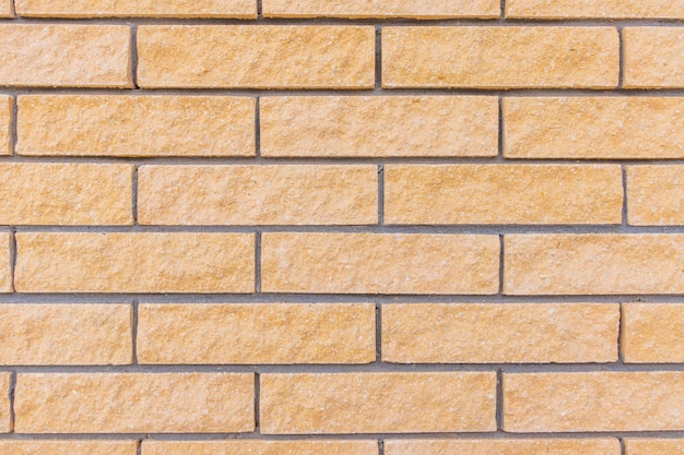 Yellow brick wall pattern background photo texture