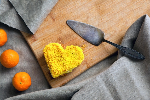 Yellow cake heart shaped Delicate dessert combines juicy tropical aromas of mango and passion fruit