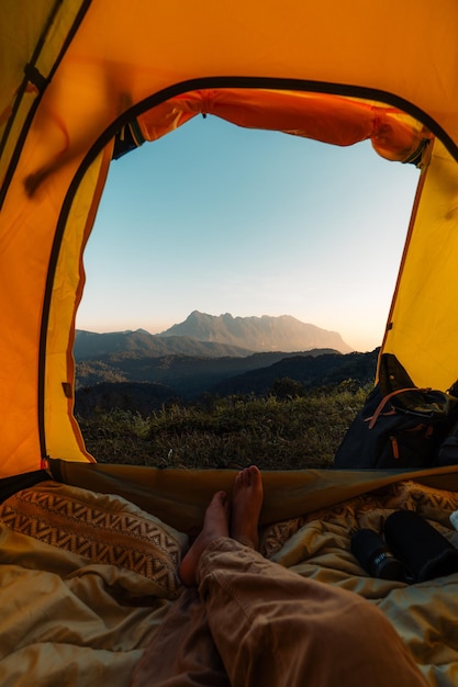 Yellow camping on the mountain, mountain view in the morning