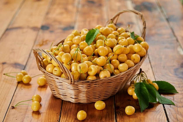 Yellow cherry seasonal harvest of berries on the table