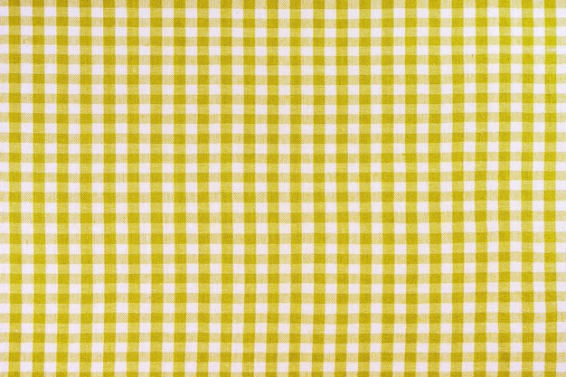 Yellow classic checkered tablecloth texture background with copy space