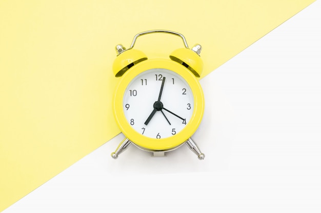 Yellow clock on yellow and white