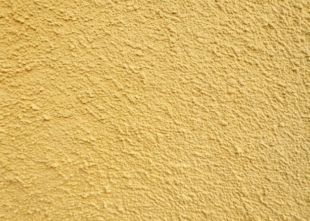 Yellow color plaster wall background