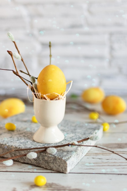 Yellow colored Easter eggs on wooden table Happy Easter time