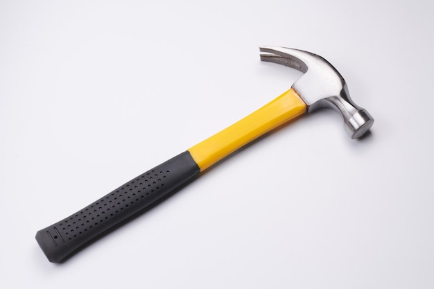 Yellow construction hammer isolated on white background closeup