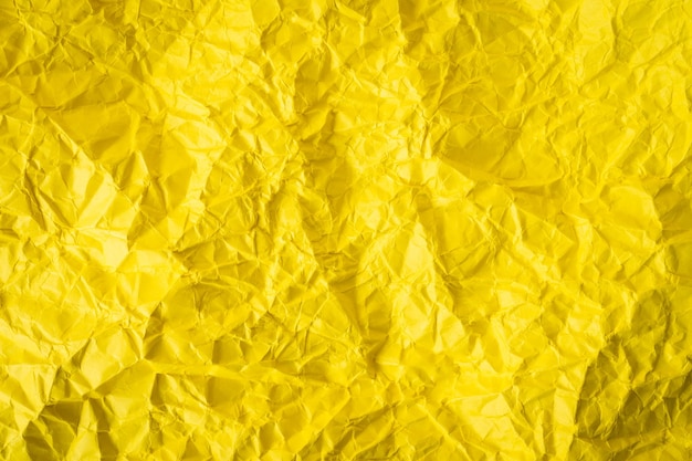 Yellow crumpled paper background