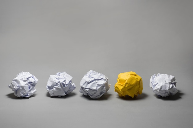 Yellow crumpled paper ball