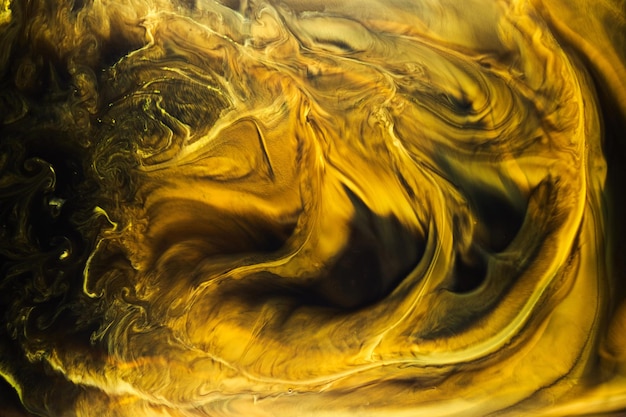 Yellow dark abstract background luxury colored smoke acrylic paint underwater explosion cosmic swirling ink