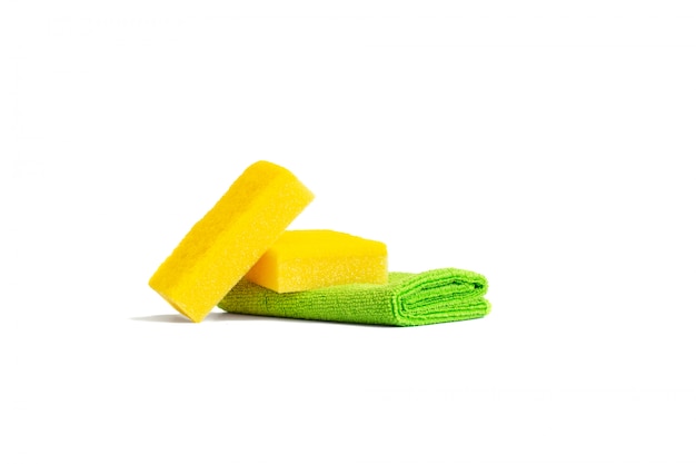 Yellow dish sponges and a green microfiber towel