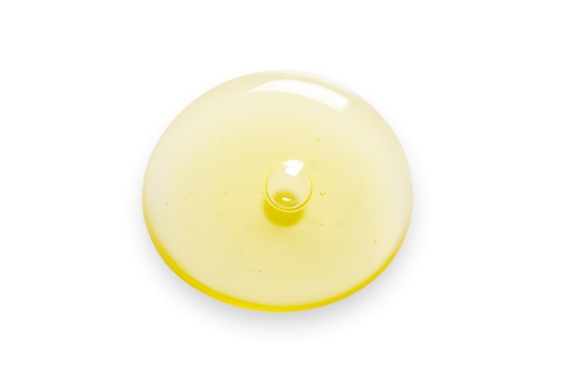 Yellow drops of gel close up Cosmetic product for moisturizing the skin of the face or body Isolated on a white background