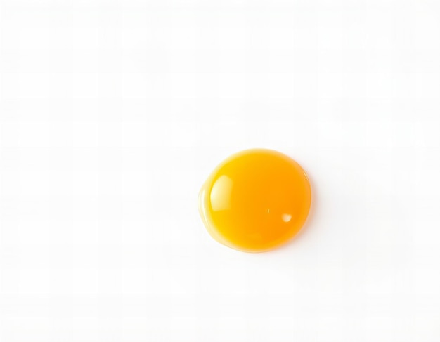 Photo a yellow egg with a yellow top and a white background