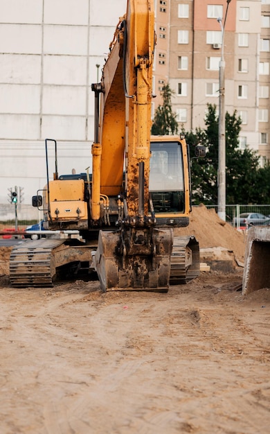 Yellow excavator earth moving at open pit