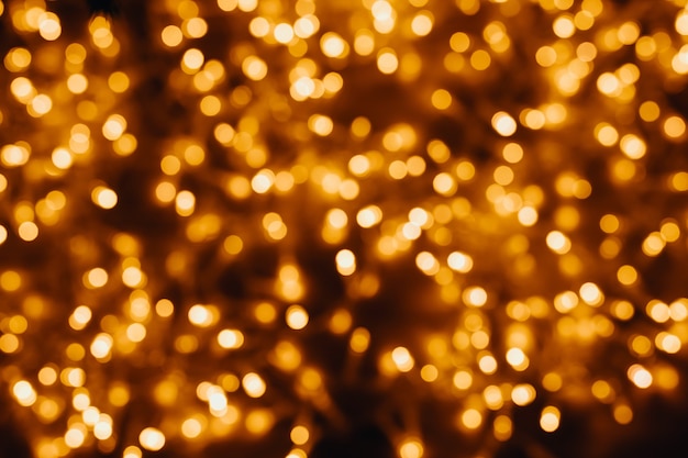 Yellow fairy lights blurry bokeh background.