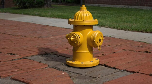 a yellow fire hydrant with the number 3 on it