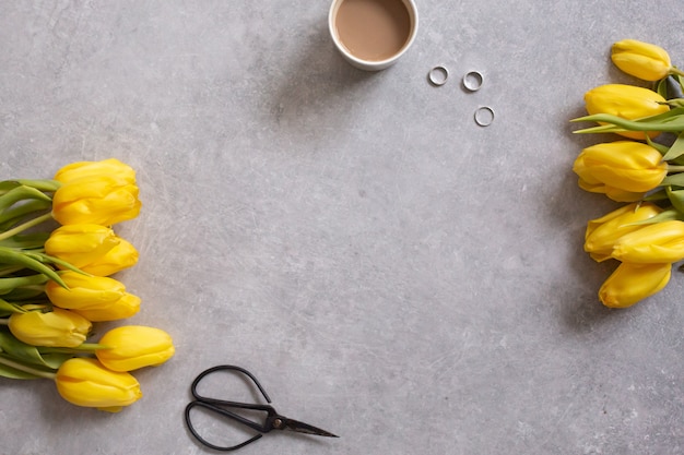 yellow flowers tulips and coffee top view