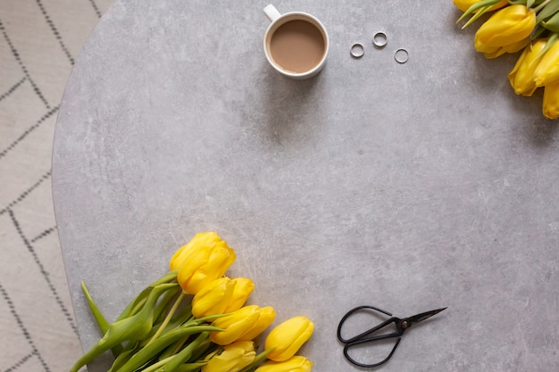 yellow flowers tulips and coffee top view