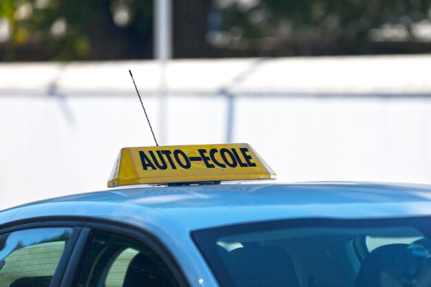 Yellow French driving school sign