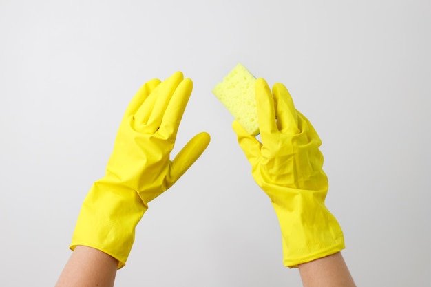 Yellow gloves for cleaning on a white background