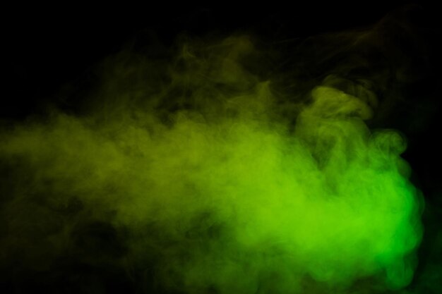 Yellow and green steam on a black background