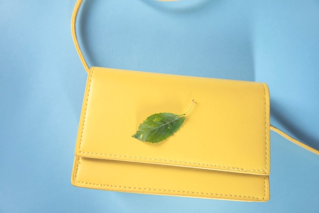 Yellow handbag with green leaf