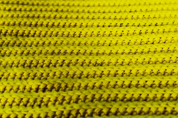 Yellow knitted fabric texture and background