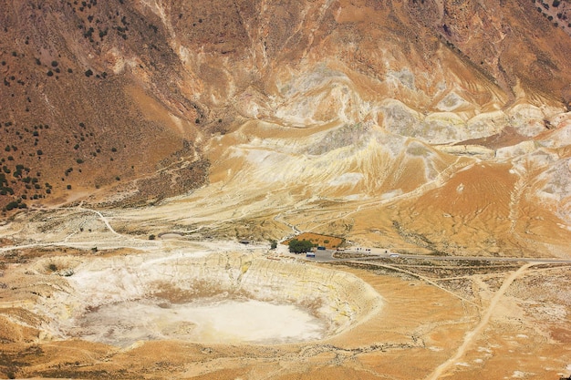 Yellow landscape of Nisyros volcano. View of the caldera, a crater with sulfur crystals