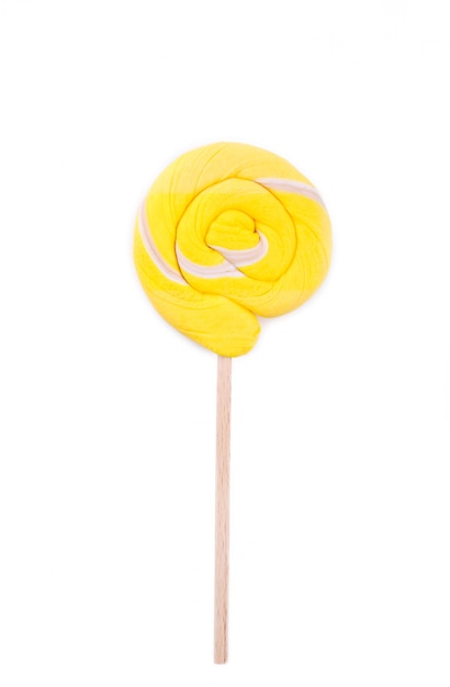 Yellow lollipop isolated on white background. Studio shot