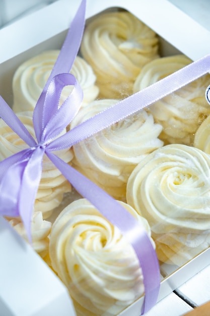 Yellow marshmallow in a box with a ribbon