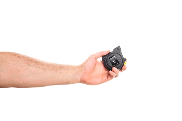 Yellow measuring tape in male hands isolated on white background