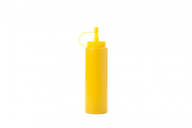 Photo yellow mustard bottle isolated on white