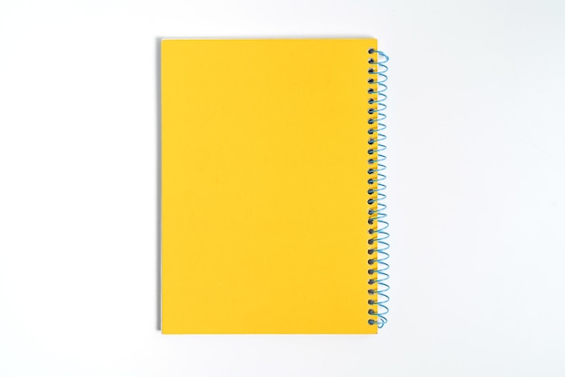 Yellow notebook on white background with clipping path - Image