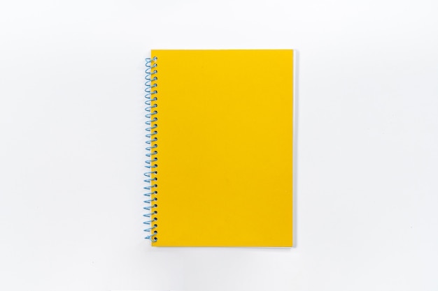 Yellow notebook on white background with clipping path - Image