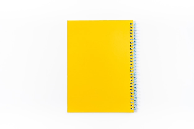 Yellow notebook on white background with clipping path - Image