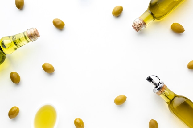 Yellow olives and oil bottles