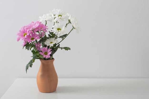 Yellow and orange flowers on white background