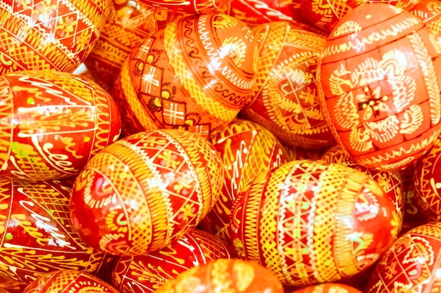 Yellow orange and red painted Easter eggs background Toned