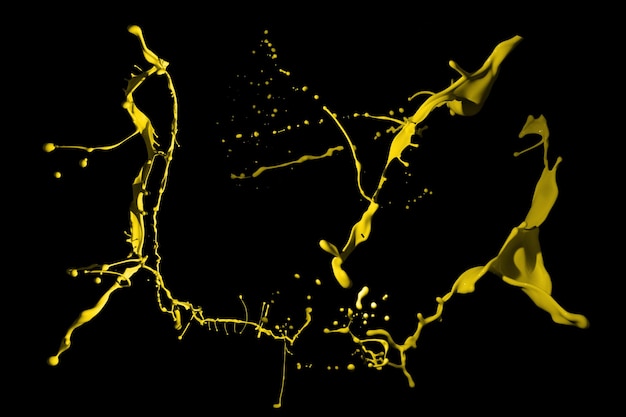 Yellow paint splashes isolated on black background