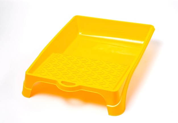 Yellow paint tray on a white isolated.