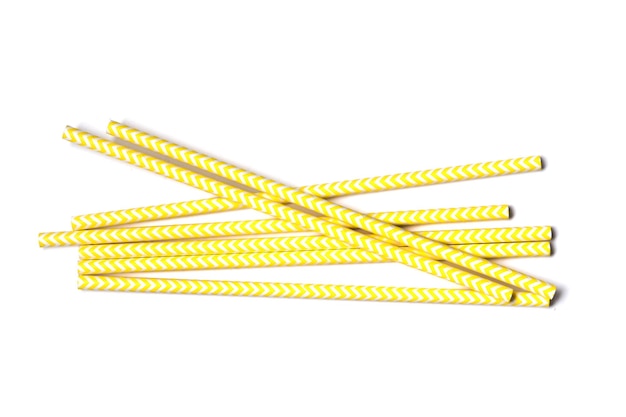 Yellow Paper straws on white background