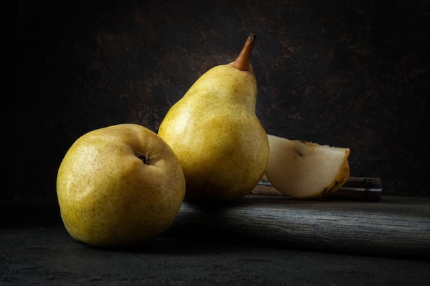 Yellow pears on a black background Fine art Still life Food poster Photo for calendar