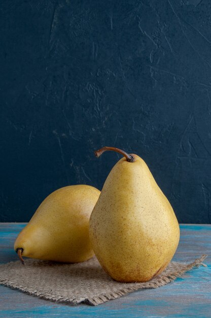 Yellow pears on shabby background