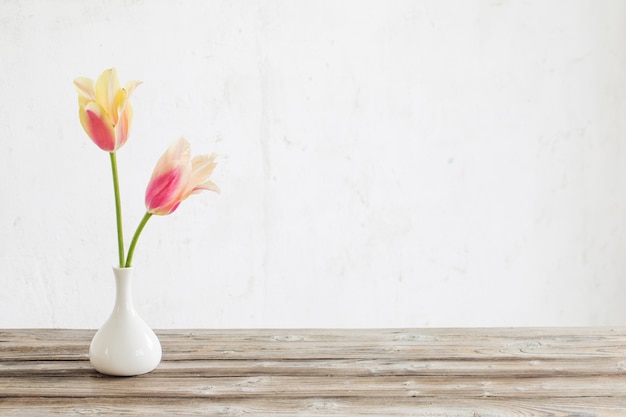 Yellow and pink tulips in vase