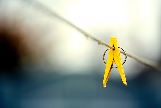 Yellow plastic clip on the rope